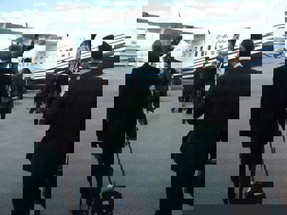 man walking towards a plane