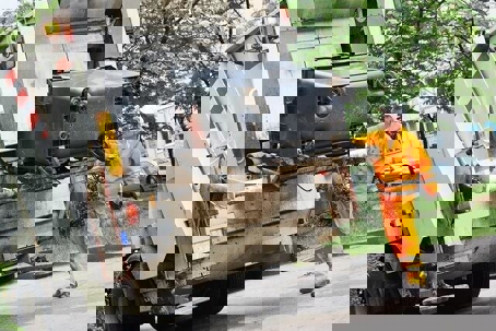 Dump truck being loaded with garbage